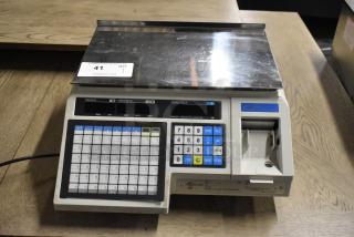 CAS LP-1000 metal countertop scale, 120V, 1 phase, featuring numeric keypad and label printer. Good condition.