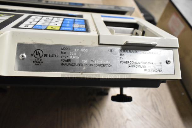 CAS LP-1000 Metal Countertop Scale, 30lb max, 0.01lb readability, 120V, 60Hz, UL listed, made in Korea. Model and serial info visible.