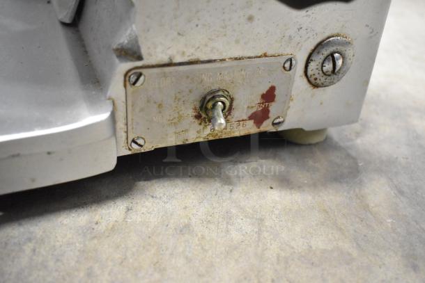 Globe stainless steel commercial countertop meat slicer with sharpening blade, model G-8526, 115 volts, 1 phase, worn condition.