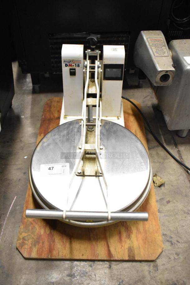 Dough Xpress DM-18 metal commercial countertop dough press in used condition, 120 volts, 1 phase, model label visible.