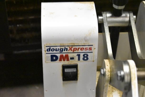 Dough Xpress DM-18 commercial dough press, metal construction, visible wear, 120 volts, 1 phase, label features brand and model.