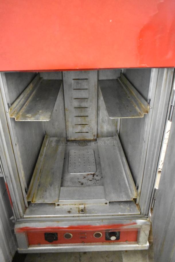 Cres-Cor Crown-X H-137-UA-12 heated holding cabinet, metal, 115V, on commercial casters, showing interior and controls.