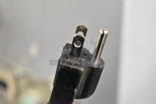 Close-up of a two-prong power plug, part of the 2024 Jun-Air 86R-3MN1-DS nitrogen generator, 120V, 1 phase.