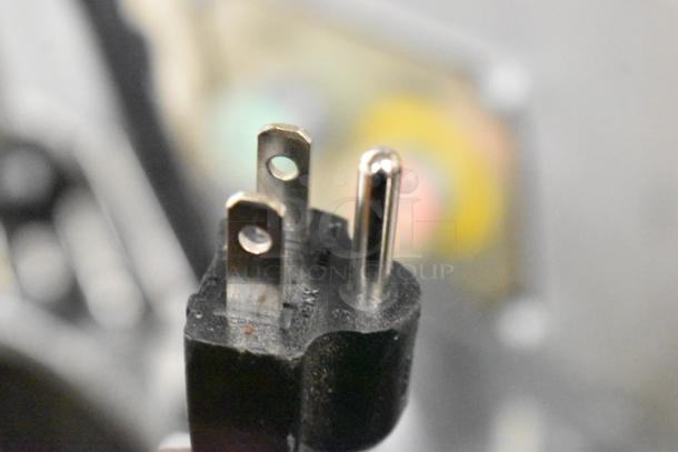 Close-up of a standard electrical plug for Jun-Air 87R-4MN1-HSBHH Nitrogen Generator, showing metal prongs.