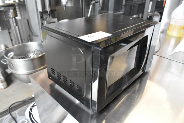 2020 Comfee EM720CPL-PMB microwave oven, black, countertop model. 120 Volts, 1 Phase, slight surface wear. Tag: 51.