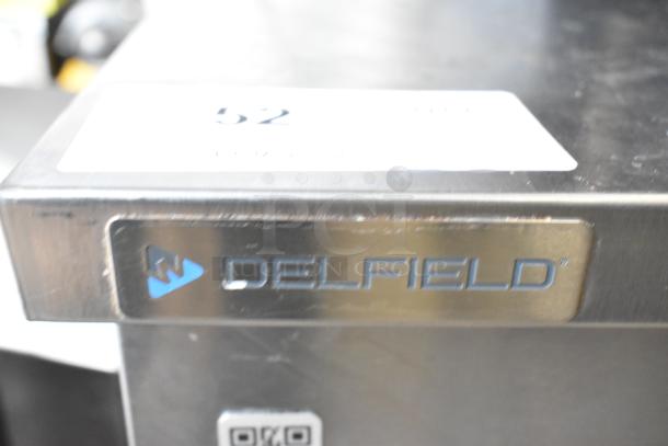 2020 Delfield 406P-STAR2 stainless steel undercounter cooler, commercial casters, 115V, Delfield logo on front.