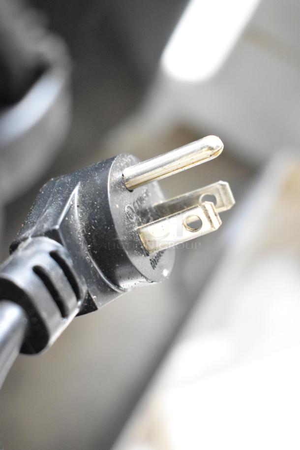 Close-up of a three-prong power plug for the Delfield 406P-STAR2 undercounter cooler, showing standard electrical design.