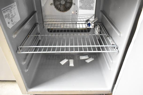 2020 Delfield 406P-STAR2 stainless steel undercounter cooler, single door, commercial casters, 115V, 1 phase. Interior view.