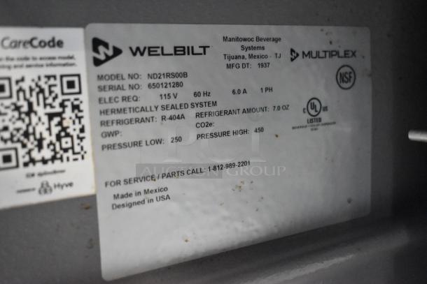 Delfield Welbilt ND21RS00B cooler label showing model, serial, 115V, 1-phase details. Made in Mexico, NSF certified.