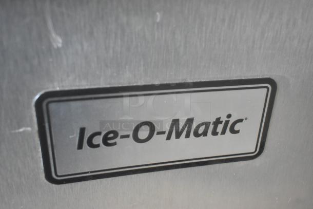 Ice-O-Matic CIM1446HR5 stainless steel commercial ice head on bin, 208-230V, 1 phase, featuring brand logo.