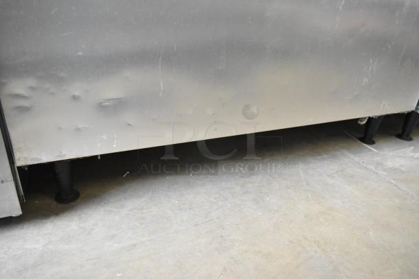 Ice-O-Matic CIM1446HR5 commercial ice head on bin, stainless steel, visible wear, 208-230V, 1 phase, dents on surface.