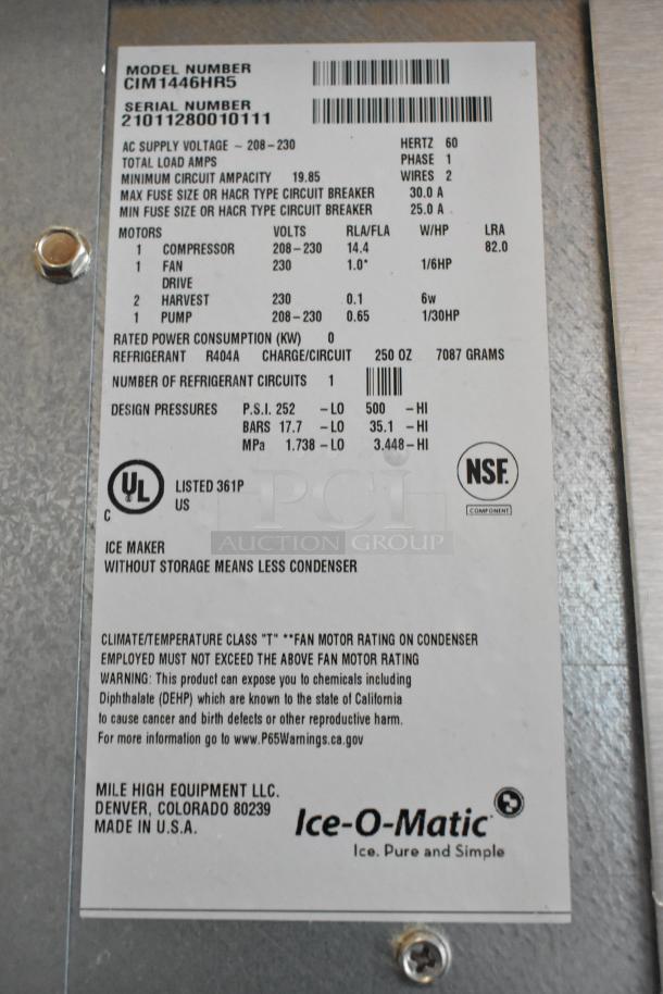 Ice-O-Matic CIM1446HR5 ice head label, showing model info, voltage, and certification marks. Stainless steel finish.