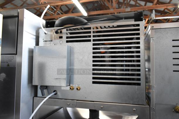 2024 Follett HMC1410WBT stainless steel ice head, 208-230V, 1 phase, on commercial ice bin, excellent condition.