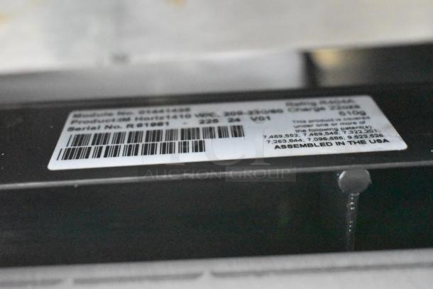 2024 Follett HMC1410WBT stainless steel ice head, commercial bin, 208-230V, 1 phase, with visible assembly tag details.