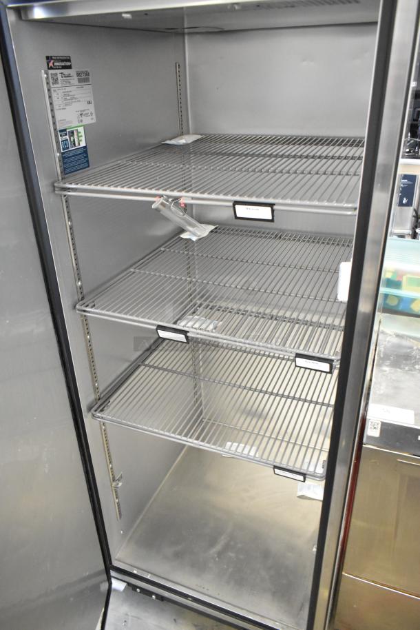2019 True TG1R-1SLH-HC commercial cooler, stainless steel, single door, poly coated racks, commercial casters, 115V, 1 phase.