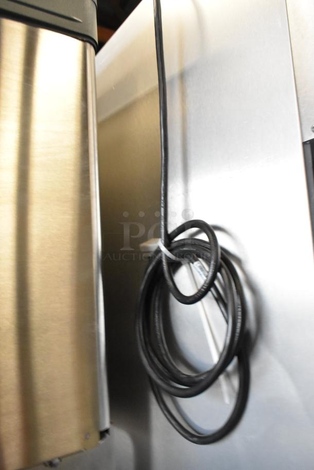 2019 True TG1R-1SLH-HC stainless steel commercial cooler, visible coiled power cord, on commercial casters.