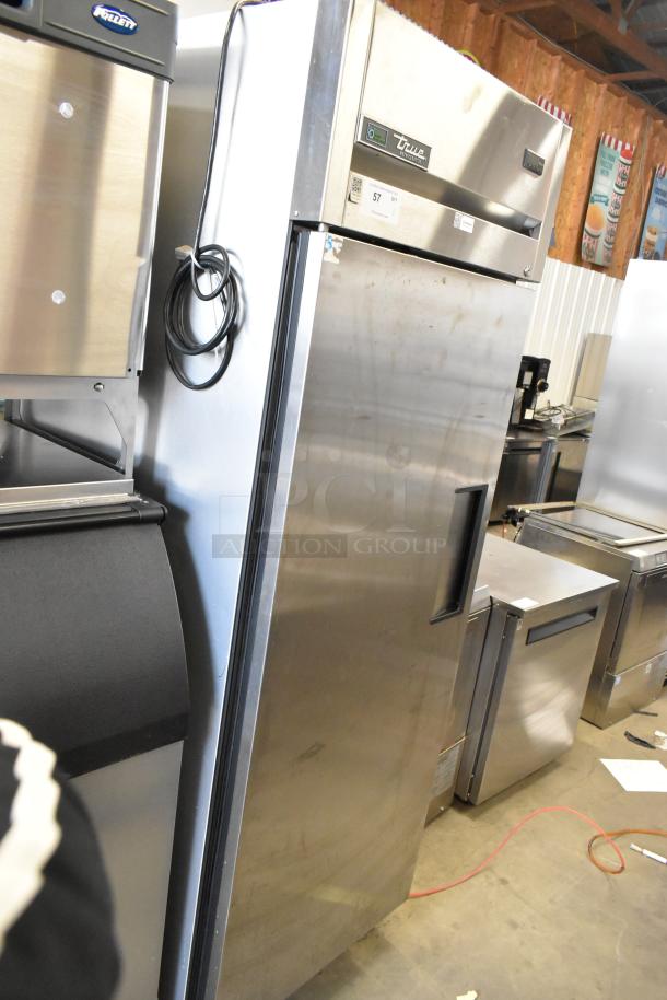 2019 True TG1R-1SLH-HC stainless steel commercial cooler, single door, poly-coated racks, on commercial casters.