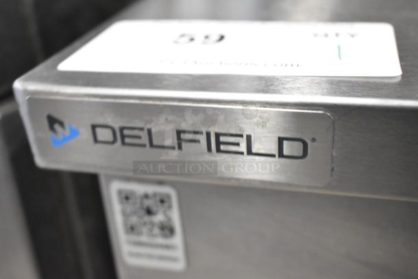 2023 Delfield 406P-STAR2 stainless steel undercounter cooler. Features single door, commercial casters, Delfield logo.
