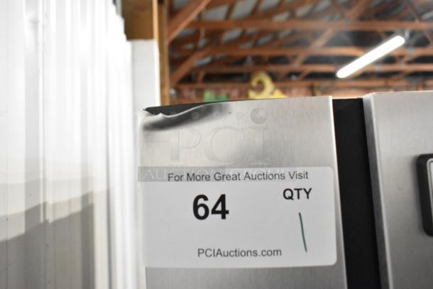 2024 Ice-O-Matic CIM1446HA6 commercial ice head on bin, stainless steel, visible dent, auction label with quantity 64 noted.