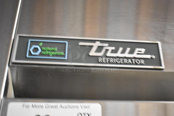2018 True TG2R-2S-HC commercial cooler, stainless steel, 2 doors, poly coated racks, on casters. Uses natural refrigerant.