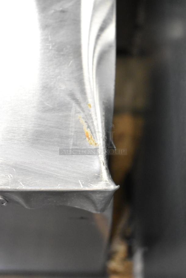 2020 Delfield 406P-STAR2 stainless steel undercounter cooler, visible dent and rust, commercial casters, single door.