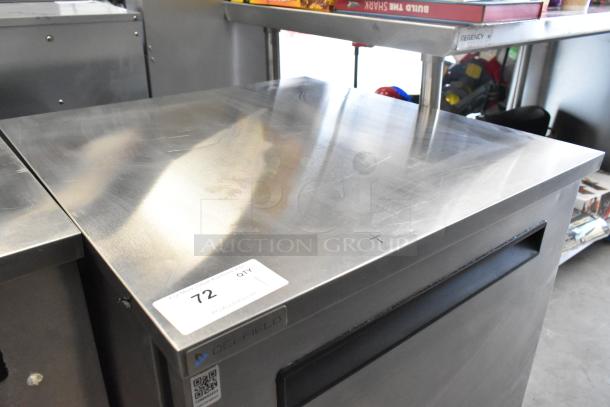 Delfield 406P-STAR2 stainless steel undercounter cooler on casters, 115 volts, single door, auction label visible.