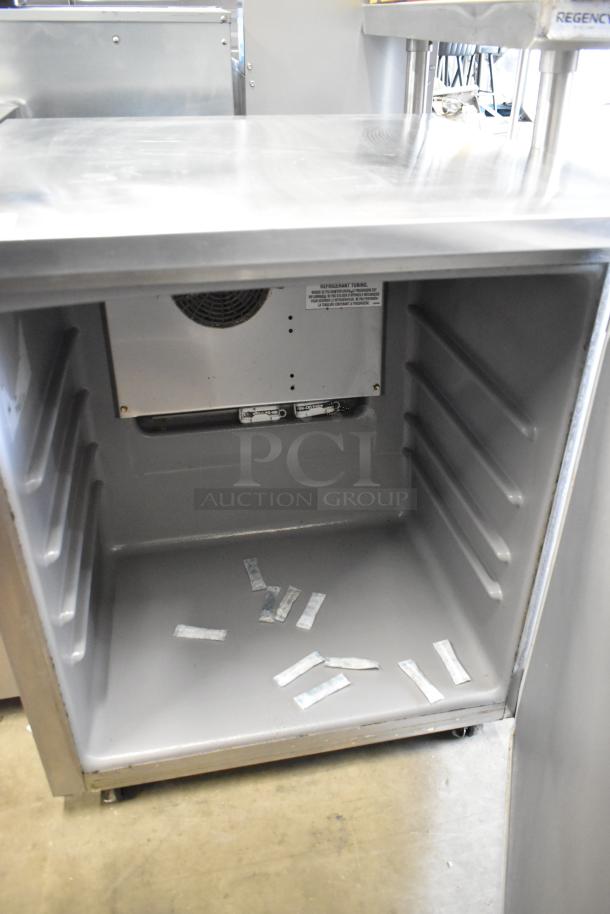 Delfield 406P-STAR2 stainless steel undercounter cooler, single door, commercial casters, 115 volts, open interior.