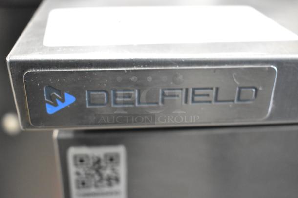 Delfield 406P-STAR2 stainless steel undercounter cooler, single door, commercial casters, 115V, 1 phase, Delfield logo visible.