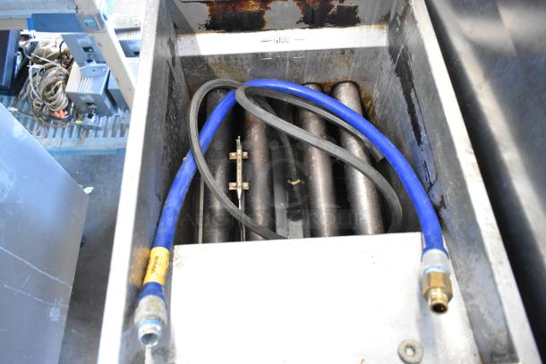 Vulcan LG400-1 stainless steel gas fryer interior showing heating elements and blue gas hose.
