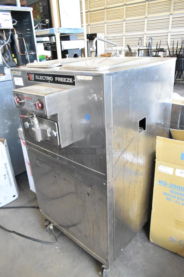 Electro Freeze 88TF stainless steel batch freezer, commercial floor style on casters, 230V, 1 phase, visible wear.