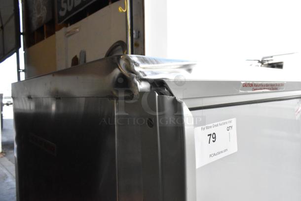 Avantco 177HPI1836 heated holding cabinet, metal construction, on casters, visible dent on top. 120V, 1 Phase. Auction label 79.