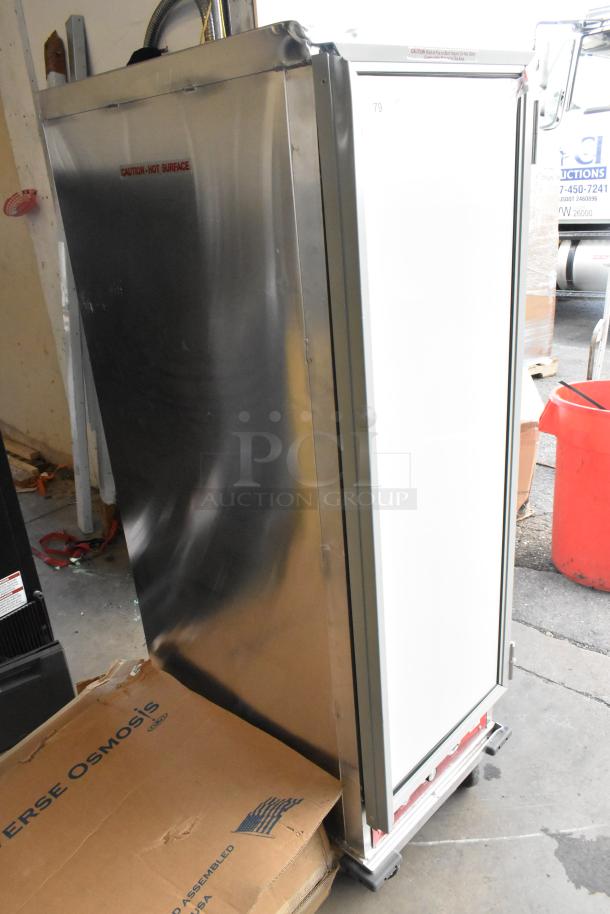 Avantco 177HPI1836 metal commercial heated holding cabinet on casters, 120V, 1 Phase, stainless steel with "Caution: Hot Surface" label.