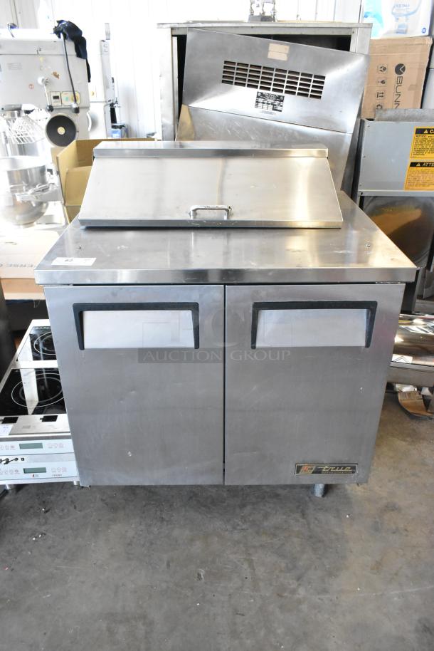 True TSSU-36-08 stainless steel prep table with bain marie top, commercial casters, 115V, 1 phase. Clean condition.