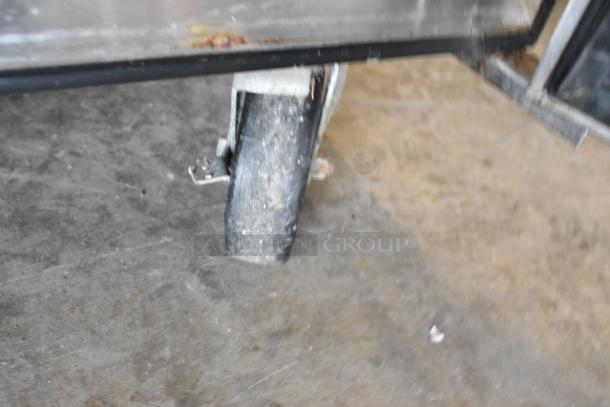 True TSSU-36-08 prep table caster, visible wear. Stainless steel, used condition. 115V, 1 phase.