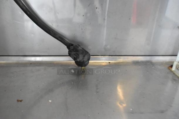 True TSSU-36-08 stainless steel sandwich prep table plug and stainless steel surface, showing moderate wear.