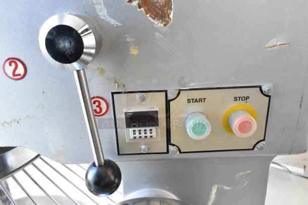 2022 Precision HD-60 Dough Mixer control panel with lever, start/stop buttons, timer, and visible wear on metal surface.