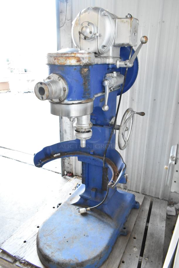 Metal commercial planetary dough mixer, floor style, in used condition with visible wear, blue and silver finish.