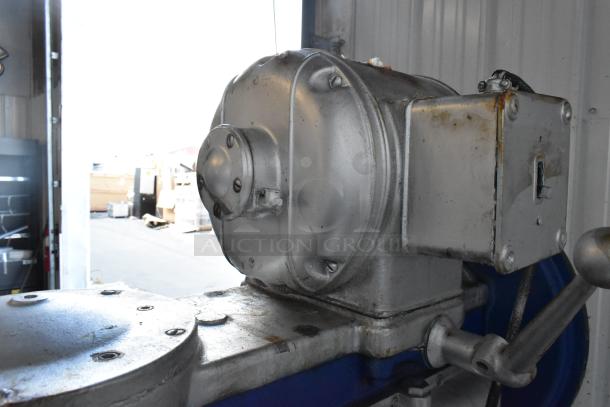 Metal commercial floor style planetary dough mixer, silver finish, visible wear, sturdy build, used condition.