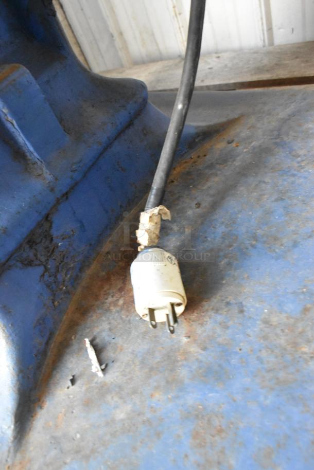Metal commercial floor-style planetary dough mixer with a blue exterior. Visible wear and a damaged electrical plug.
