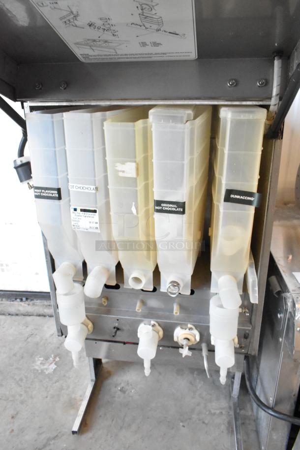 Bunn IMIX-5 stainless steel cappuccino machine. Features multiple labeled dispensers inside. Model IMIX-5. Suitable for commercial use.