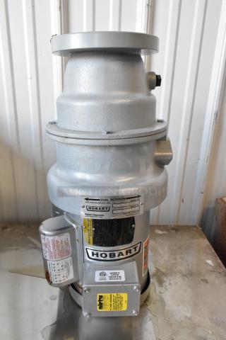Hobart FD4/75-3 commercial garbage disposal, metal, visible model tags. In good condition, suitable for heavy use.