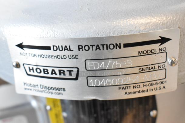 Hobart FD4/75-3 commercial garbage disposal, metal, shown with label indicating model and serial numbers, dual rotation.