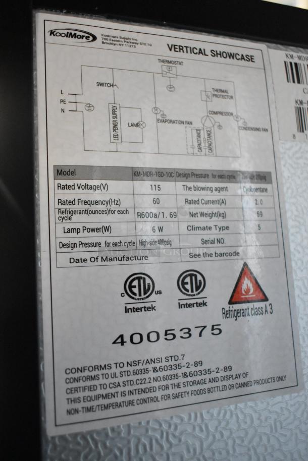 Label on KoolMore KM-MDR-1GD-10C cooler shows specifications: 115V, 1 phase, 60Hz, 6W lamp, R600a refrigerant.