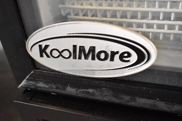KoolMore KM-MDR-1GD-10C cooler logo detail, metal frame visible. New with scratches, dent; poly racks, commercial casters.