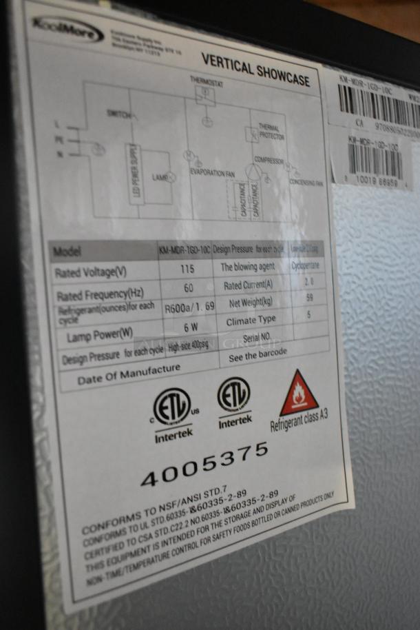 KoolMore KM-MDR-1GD-10C label showing model, 115 volts, 60Hz frequency, refrigerant R600a, and safety certifications.