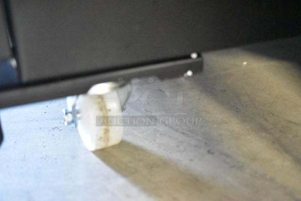 KoolMore KM-MDR-1GD-10C commercial cooler caster on concrete floor, features poly-coated racks, 115V, 1-phase, scratch and dent.