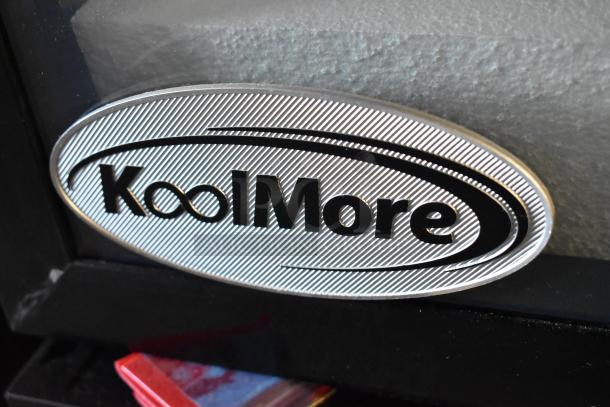 KoolMore brand label on a commercial cooler, model KM-MDR-1GD-10C, indicating a new scratch and dent item.