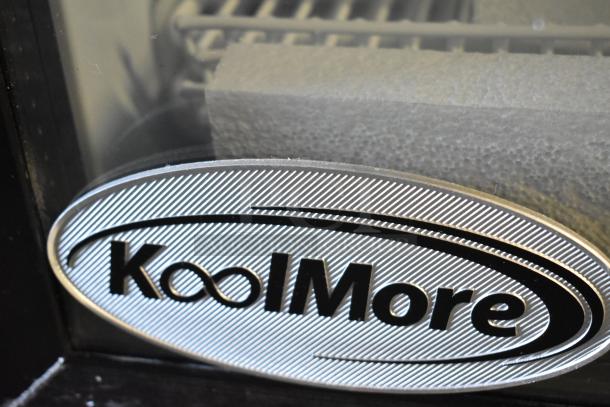 KoolMore KM-MDR-1GD-10C commercial cooler, poly-coated racks, on casters. Brand logo visible. 115V, single phase. New scratch and dent.
