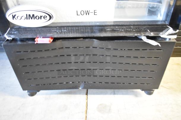 Brand new KoolMore KM-MDR-1GD-10C metal cooler with poly coated racks, minor dents, KoolMore and LOW-E labels visible.