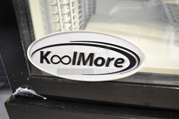 KoolMore KM-MDR-1GD-10C commercial cooler with poly racks, visible logo and scratch on surface, on casters, 115V, 1-phase.